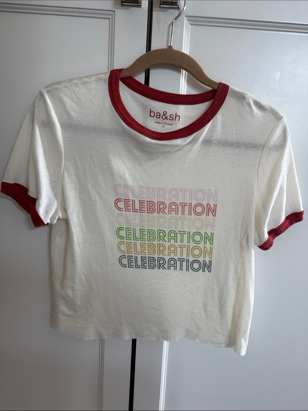 ba&sh White Tee with Red Trim and Multicolor Celebration Print raw edge bottom